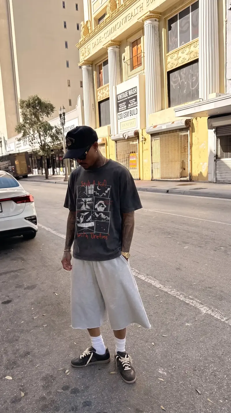 Model wearing the 'Still a kid with dreams' graphic tee